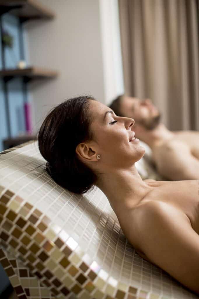 backlited flowers in vase on the table in sunset time